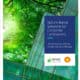 Cover image for the report titled "Nature-Based Solutions for Corporate Landowners," featuring a modern glass building surrounded by lush green trees, highlighting interventions to address climate change challenges, produced by the Wildlife Habitat Council and Shell.